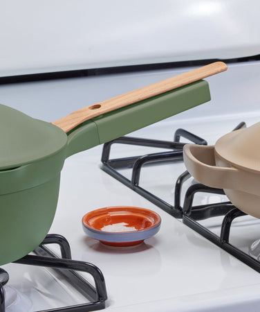 Green Mini Perfect Pot and beige Mini Always Pan on the stove