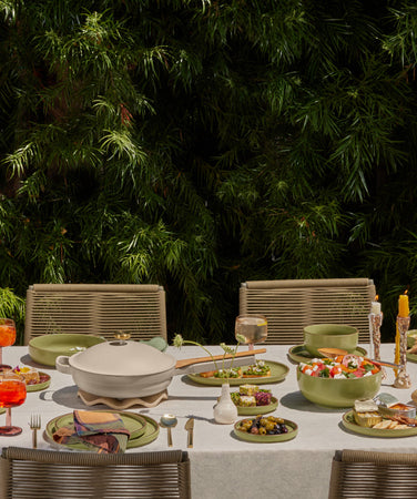 our place dinnerware and cookware set on table outside