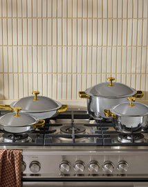 a set of titanium cookware on stove