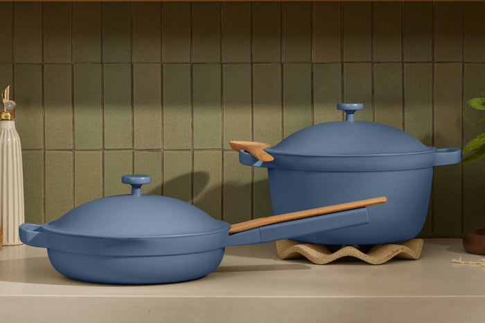 A blue pan and a blue pot on a countertop