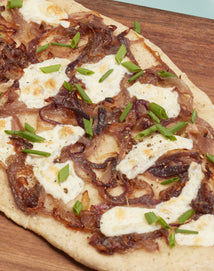 Close-up of Steam-Infused Za’atar Flatbread on a wooden board.