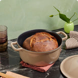 beige cast iron perfect pot with bread