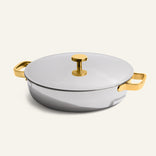 The Titanium Braiser Pro 28 cm features gold-tone handles and lid knob, showcased on a plain light background.
