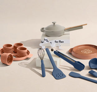 Set of kitchen utensils and cookware on a beige background with 'Our Place' branding.