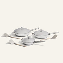 chrome titanium large always pan pro, always pan pro, and mini always pan pro with stainless steel spatulas