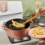 pink cast iron perfect pot frying french fries on stovetop