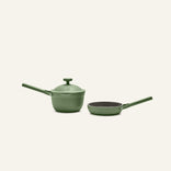The Tiny Cookware Duo, featuring a green Perfect Pot with lid and a matching non-toxic frying pan with long handles, is displayed against an off-white background.